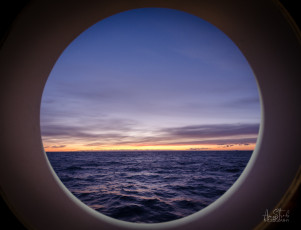 East Antarctica | The Sun Rising Over Antarctica Through The Galley Porthole
